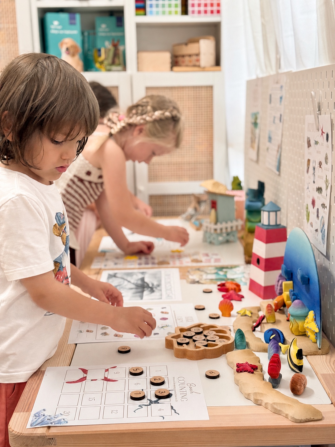 Children exploring a hands-on ocean investigation during an enrichment class