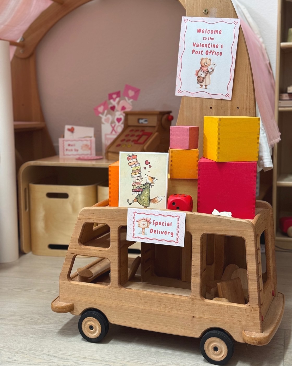 A wooden Valentine post office and special-delivery truck ready for the quest
