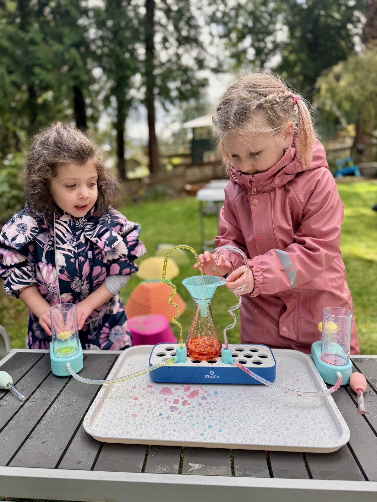 Children conducting a hands-on science experiment outdoors
