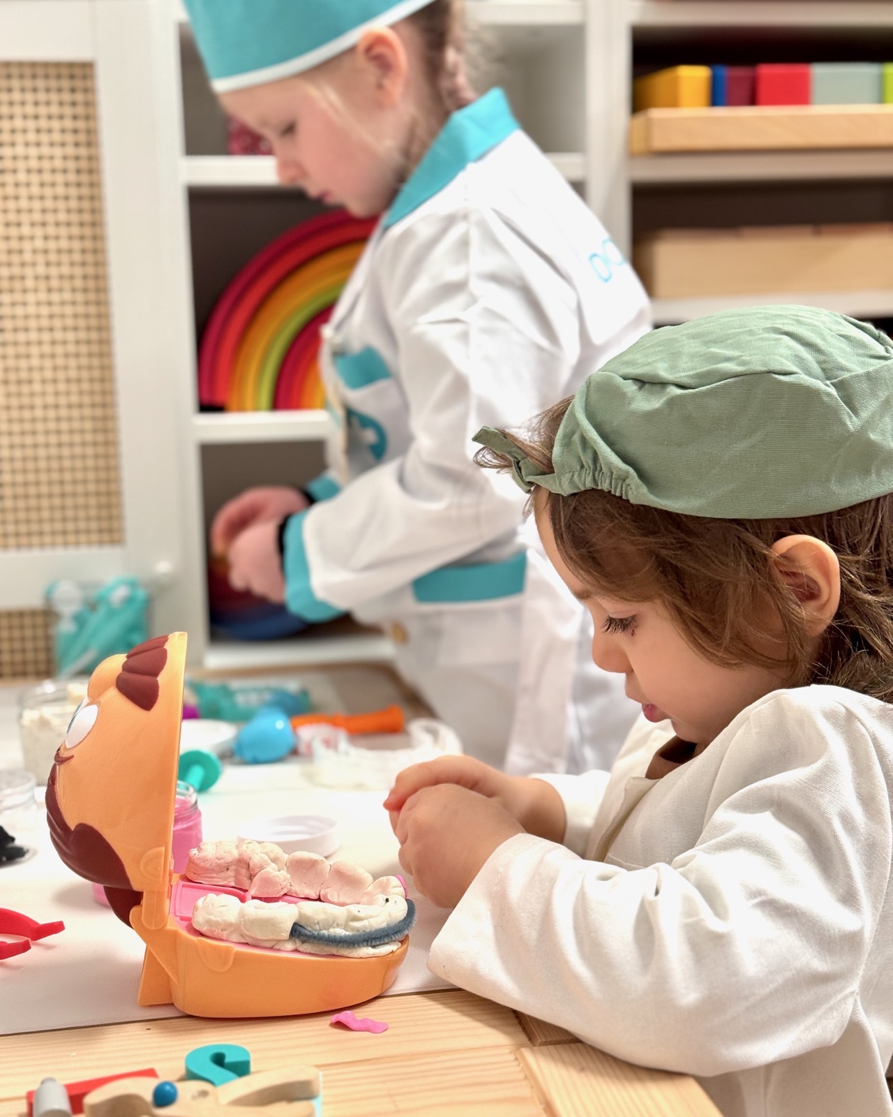 Children engaged in dentist-themed pretend play