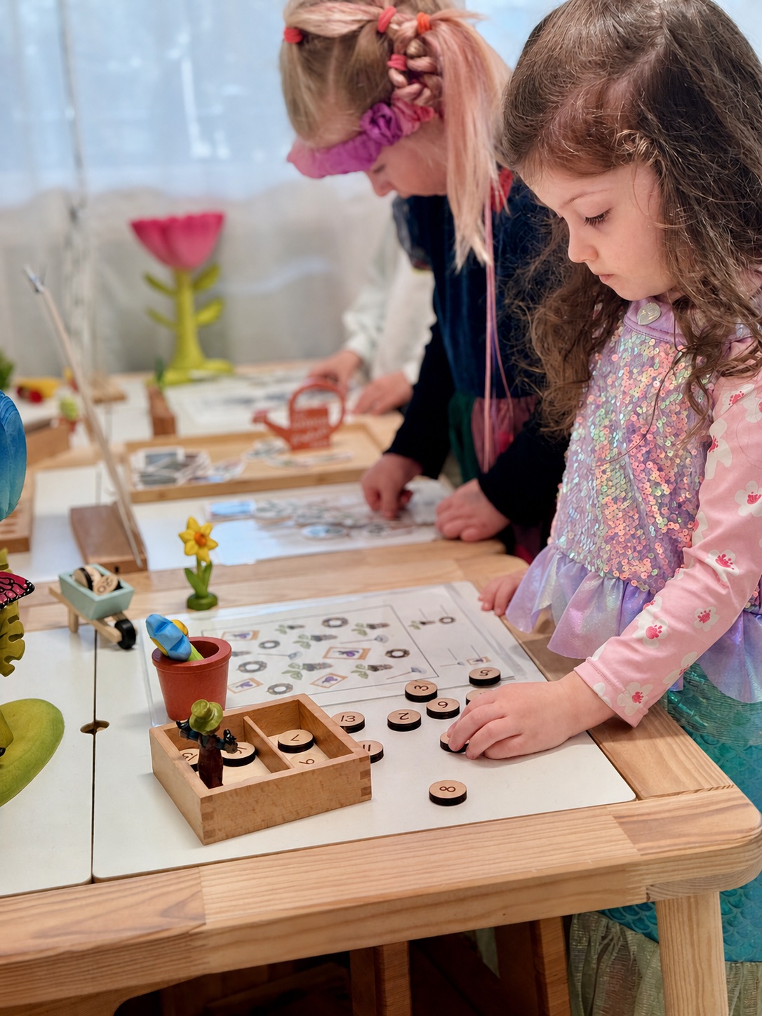 Children solving a hands-on number activity during an enrichment class